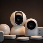 Close-up of modern white security cameras and smart home devices with dark background.
